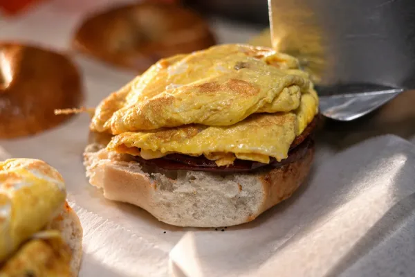 egg-being-placed-on-bagel-spatula copy